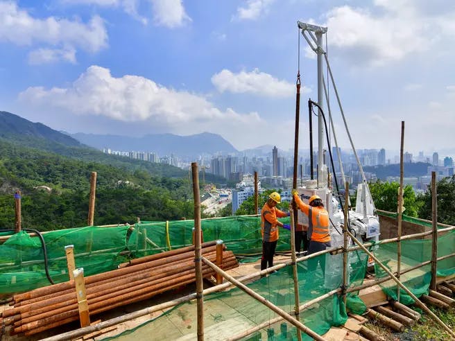 Employees working on drilling operation for Lung Cheug Road, Hong Kong